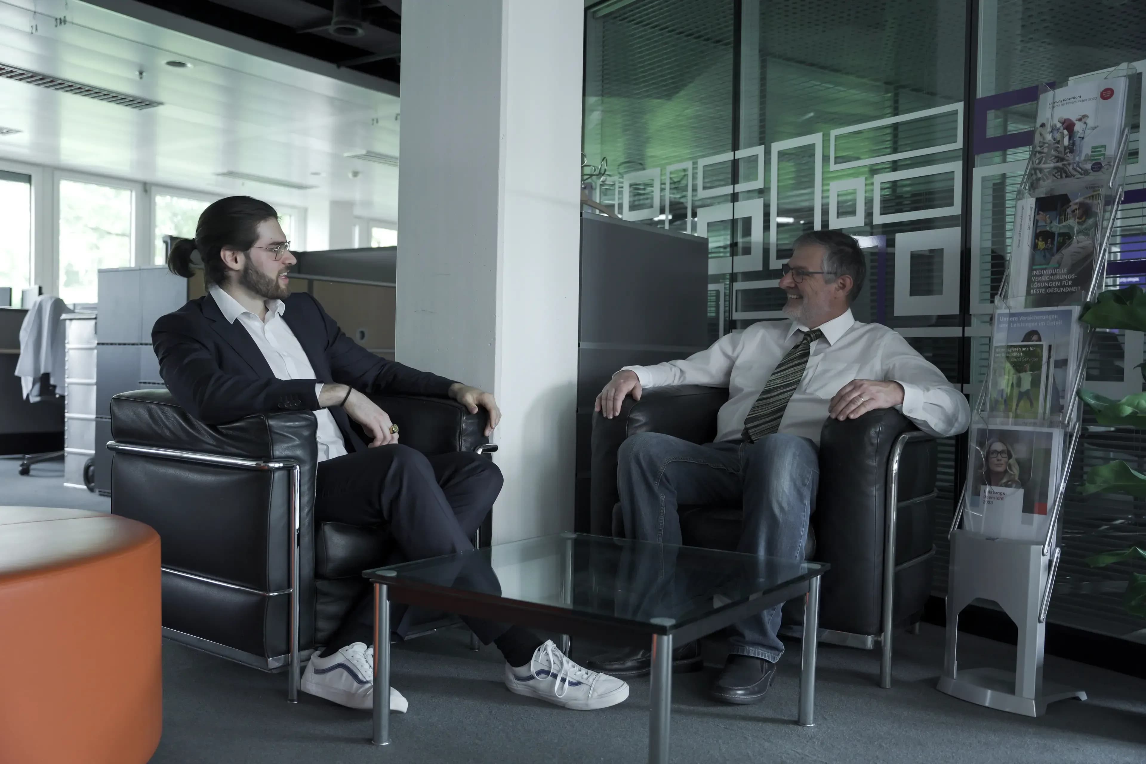 Two men sitting and talking